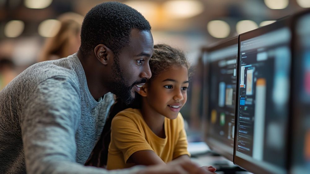 Father and daughter at computer